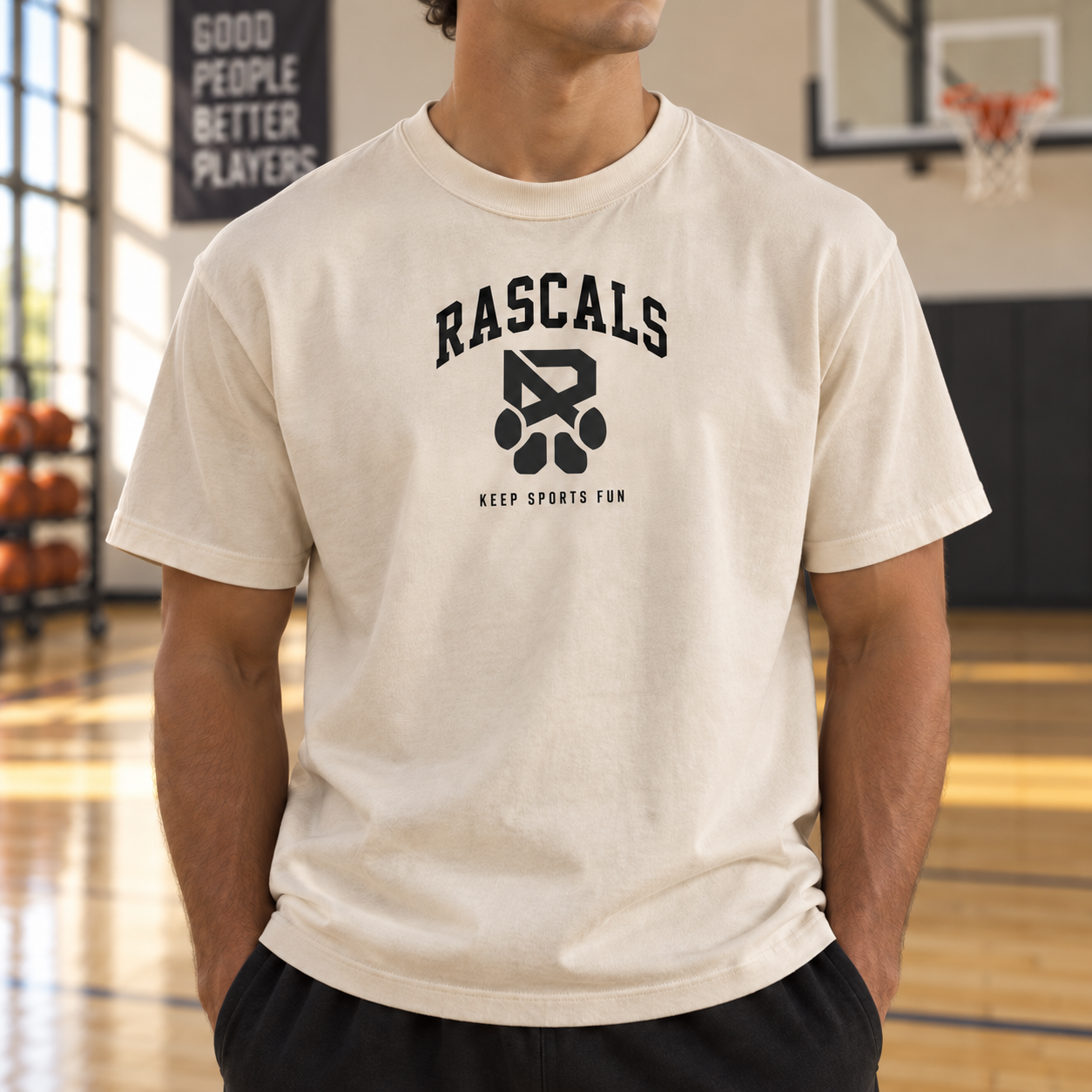 Existing bone shirt mockup with RASCALS, the R-and-paw logo, and KEEP SPORTS FUN on the front